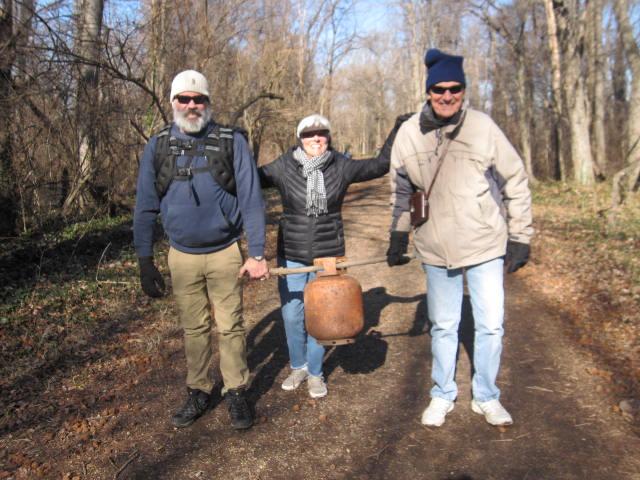 Three people lugged out a propane gas tank Left to right Jason Manarin Suzanne Kalvaitis and Al Kalvaitis